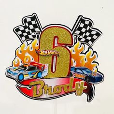 the number six is decorated with cars and flames