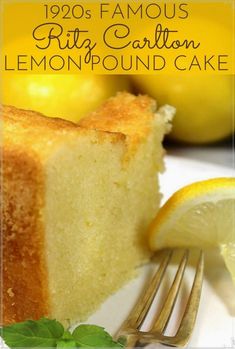 a close up of a piece of cake on a plate with lemons in the background