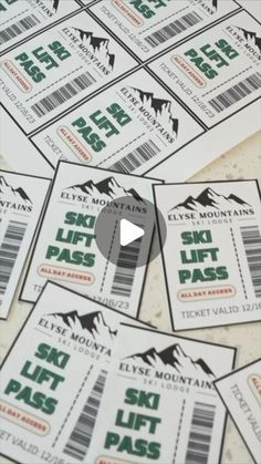 six ski lift passes sitting on top of each other in front of a pile of tickets