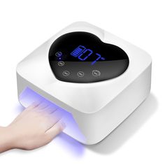 a person's hand is pressing the button on an alarm clock with blue light