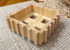 a wooden object sitting on top of a table