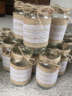 mason jars with burlock and twine are stacked on top of each other