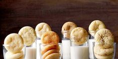 several different types of cookies and milk on a table