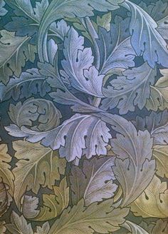 an intricately designed wallpaper with blue and green leaves on the bottom half of it