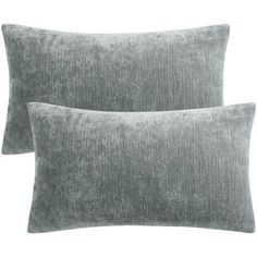 two grey velvet pillows on a white background