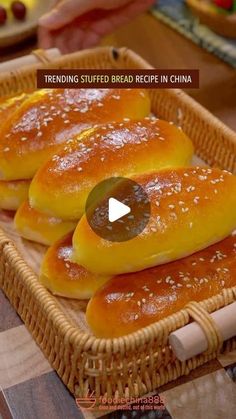 some breads are sitting in a basket on a table