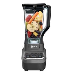 a blender filled with lots of different types of fruit