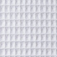 white textured paper with squares and dots on the bottom, as well as an oval shape