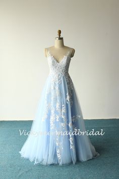 a light blue dress with white flowers on it