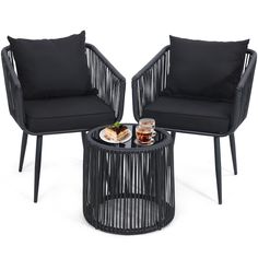 two chairs and a table with food on it in front of a white background the chair has black cushions