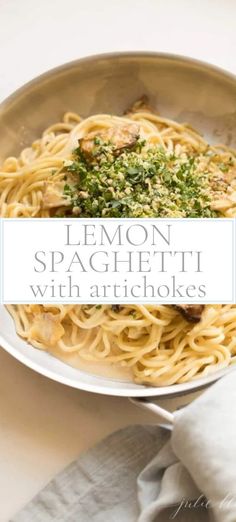 lemon spaghetti with artichokes and parsley in a bowl on a table