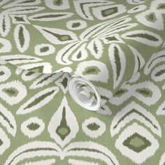 a green and white wallpaper with an abstract design