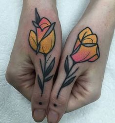 two hands with yellow and pink flowers on them