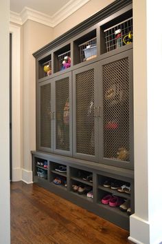 the inside of a room with several shelves and shoes on it, as well as an advertisement for wood doors