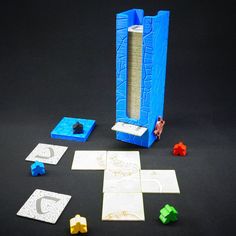 a game set up with pieces of paper and dice