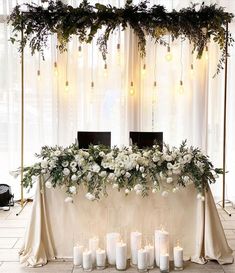 a table with candles and flowers on it