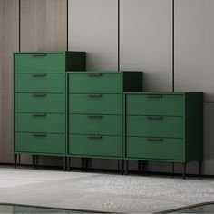 a green cabinet sitting next to a wall with two doors on each side and three drawers on the other side