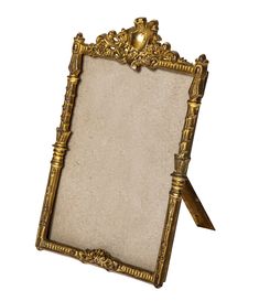 an ornate gold frame with a ribbon around it