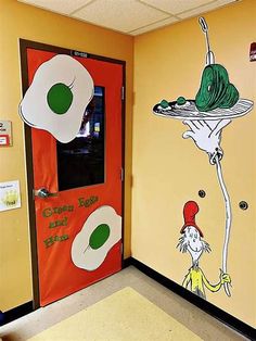 a classroom door decorated with the dr seuss theme and an image of a cat in the hat