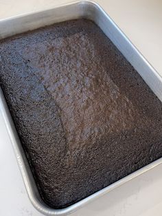 a pan filled with brownies sitting on top of a counter