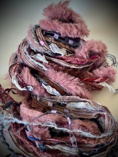 a pile of scarves sitting on top of a table