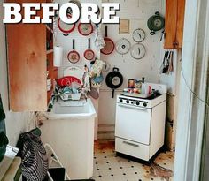 a kitchen with lots of pots and pans on the wall