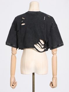 Tune into your rebellious side when you wear The DISTRESSED STUDDED SHORT SLEEVE T SHIRT ! Crafted from a semi-stretchy cotton base fabrication, this grunge-inspired top features a mineral wash finish, a mock neckline, short sleeves, a cropped silhouette with a raw hemline, and an easy pull-on fit. Complete with ultra-distressed ripped accents, cut out detailing, silver metallic pointed studs, and safety pin embellishments, successfully delivering that sought-after alternative flare. Style with a bralette, relaxed fit denim, and platform sneakers to finish off your look.Size Chart（CM）: