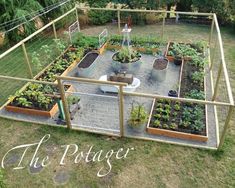 an overhead view of a vegetable garden with lots of plants in pots and raised beds