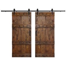 two wooden doors with metal handles and bars on each side, one open to reveal the other