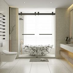 a bathroom with a tub, toilet and sink in it's center wall is shown