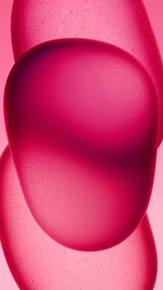 an abstract pink background with bubbles in the middle and one large bubble at the bottom