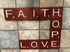 the word faith spelled with scrabble tiles