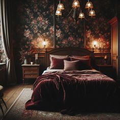 a bedroom with floral wallpaper and red bedding