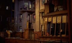 an apartment building at night with people standing on the balconies and looking out