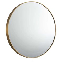 a round mirror sitting on top of a metal stand