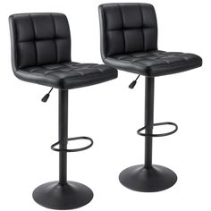 two black leatherette bar stools with footrests on each side and an adjustable seat