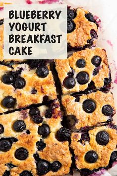 blueberry yogurt breakfast cake cut into squares on a plate with the words, blueberry yogurt breakfast cake