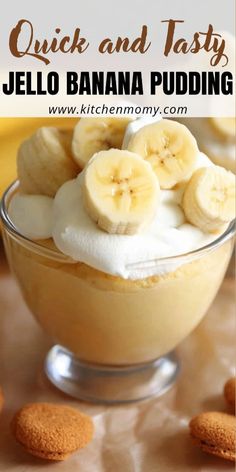 a bowl filled with bananas and whipped cream on top of a table next to cookies