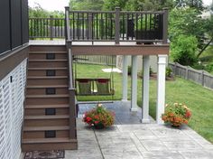 an outdoor patio with stairs and potted plants