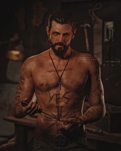 a shirtless man holding a knife in his hand and looking at the camera with tattoos on his chest