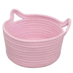 a pink basket with handles on the bottom and rope in the middle, sitting on a white