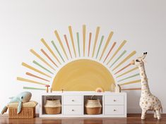 a toy giraffe standing in front of a white cabinet with baskets on it