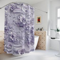 the shower curtain is decorated with purple flowers