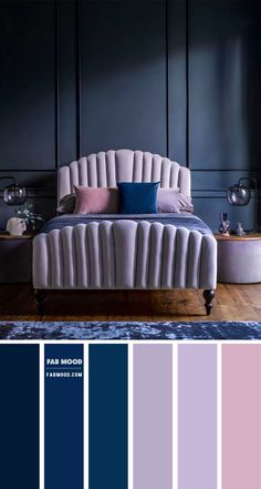 a bedroom with blue and pink colors in the walls, along with an upholstered bed