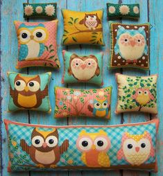 there are many pillows that have owls on them