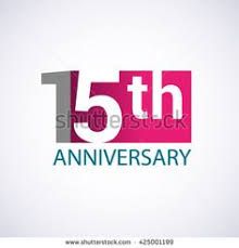 an anniversary logo with the number fifteen and it's color pink, blue and green