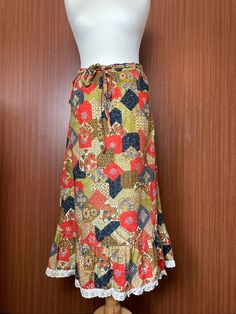 A lovely 1950s Floral Skirt. Tie belt around the waist, and clasp fastening on either side Waist 30 inches Length 32 inches Great condition Vintage Long Lined Skirt, Vintage Cotton Maxi Skirt, Vintage Multicolor Long Skirt, Vintage Cotton Maxi Skirt With Lining, Vintage Cotton Tiered Maxi Skirt, Retro Spring Skirt With Belt Loops, Vintage Multicolor Skirt, Vintage Multicolor Lined Skirt, Vintage Pleated Maxi Skirt