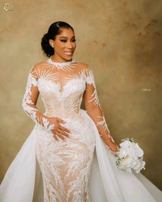 a woman in a wedding dress posing for the camera