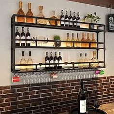 there are many bottles and glasses on the shelves