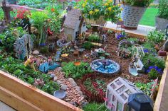 a garden filled with lots of different types of flowers and plants in it's center